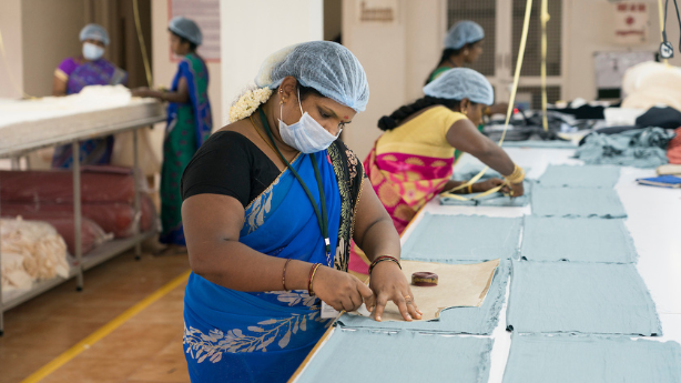 connoisseur-fashion-fair-trade-factory-worker-measuring-cloth connoisseur-fashion-fair-trade-factory-worker-measuring-cloth