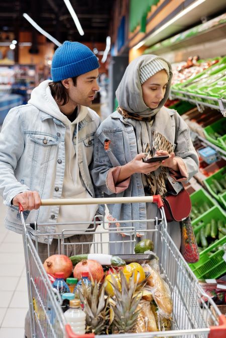 two-shoppers-in-grocery-store-stock-photo two-shoppers-in-grocery-store-stock-photo
